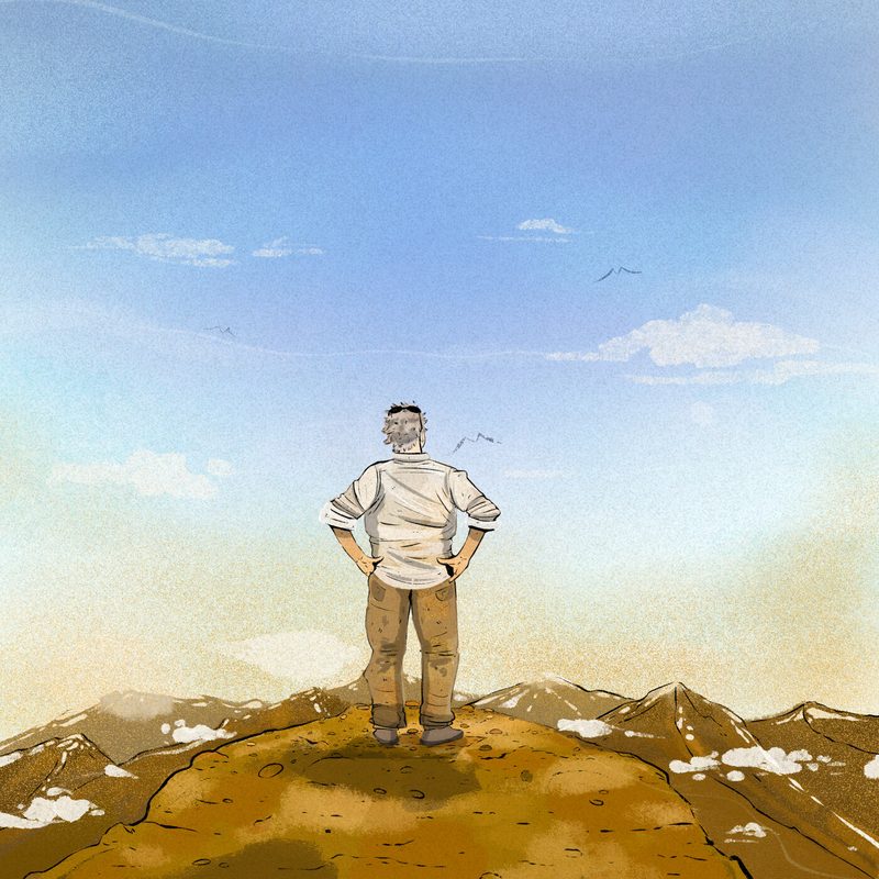 Steve standing on Mount Toubkal, looking out at the journey ahead of him.